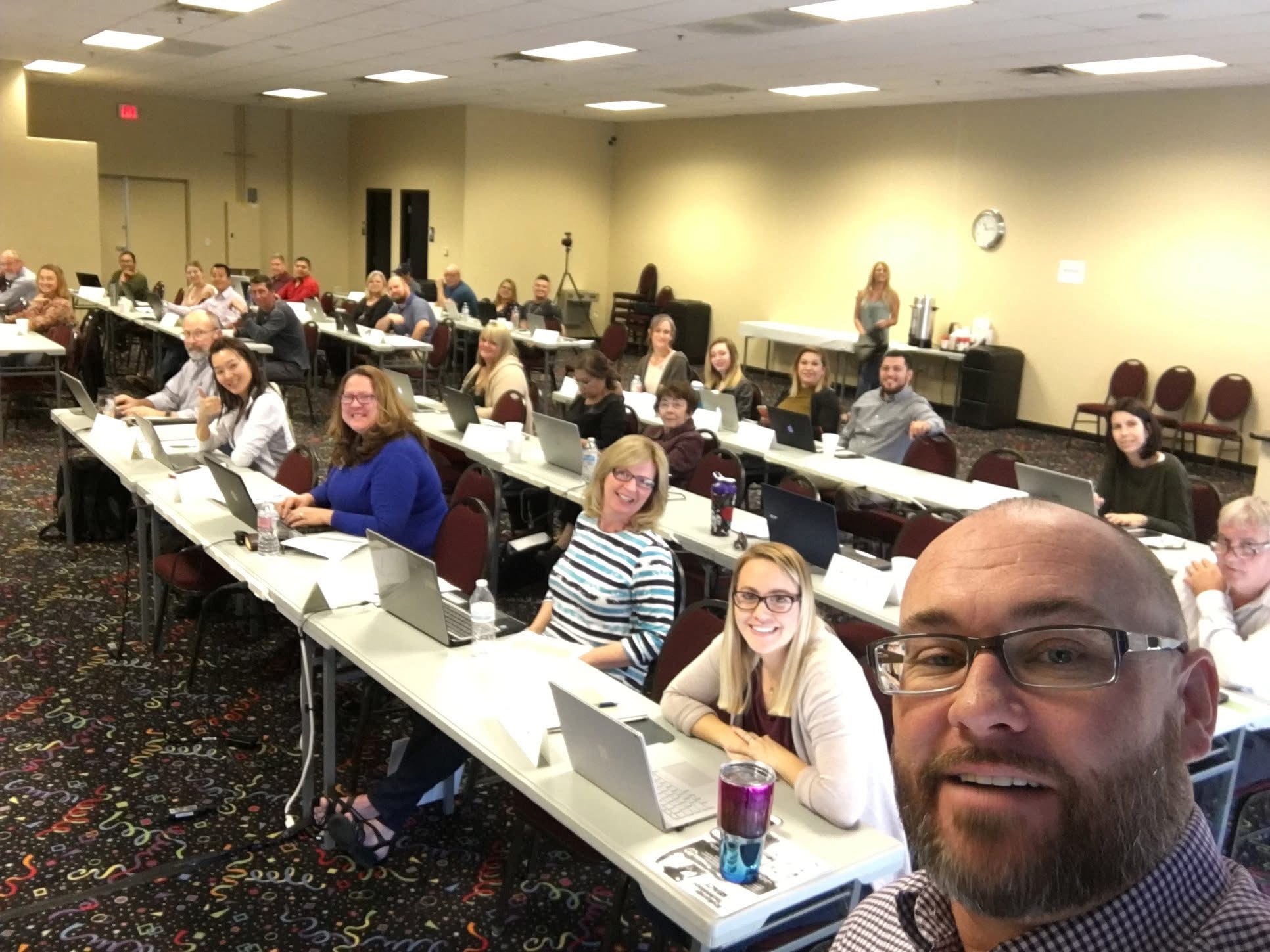 Keith Flynn with a large classroom of real estate professionals