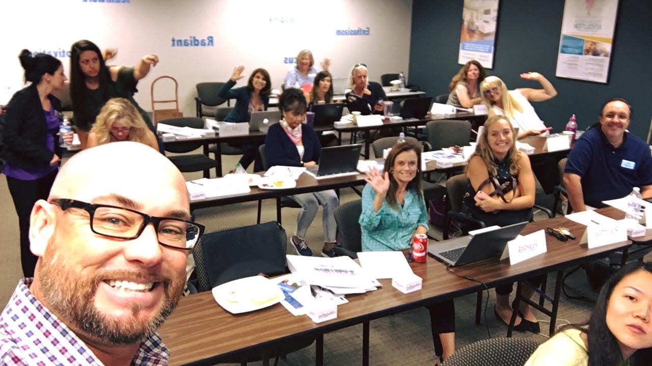 Real estate professionals participating in a marketing workshop with Keith Flynn